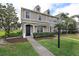 Charming two-story home with well-manicured lawn and inviting front entrance at 8850 Christie Dr, Largo, FL 33771