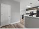 Open kitchen concept featuring modern appliances and decorative backsplash at 8850 Christie Dr, Largo, FL 33771