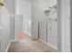 Laundry room with a washer and dryer, with a carpeted hallway in view at 8850 Christie Dr, Largo, FL 33771