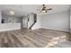 Spacious living room featuring stairs and ample natural light at 8850 Christie Dr, Largo, FL 33771