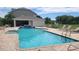 Relaxing community pool with lounge chairs and a shaded pavilion, ideal for leisure and socializing at 8850 Christie Dr, Largo, FL 33771