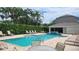 Resort-style swimming pool with lounge chairs, perfect for relaxation and enjoying the sun at 8850 Christie Dr, Largo, FL 33771