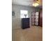 Bedroom with a ceiling fan, dresser, tile flooring and a window with natural light at 935 Shasta Rd, Venice, FL 34293