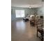 Spacious living room with tile floors, comfortable seating, and ample natural light at 935 Shasta Rd, Venice, FL 34293