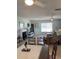 Open living and dining area with tile floors, a fireplace, and plenty of space for entertaining at 935 Shasta Rd, Venice, FL 34293