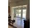 Bright sun room with tile floors and sliding glass doors leading to the outdoor patio at 935 Shasta Rd, Venice, FL 34293