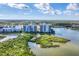 Scenic aerial view of waterfront condos surrounded by serene landscapes and natural beauty at 10520 Boardwalk Loop # 504, Lakewood Ranch, FL 34202