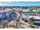 Aerial view of a vibrant commercial street lined with shops, restaurants, and palm trees at 10520 Boardwalk Loop # 504, Lakewood Ranch, FL 34202