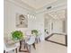 Dining room with modern table set and decorative painting at 10520 Boardwalk Loop # 504, Lakewood Ranch, FL 34202