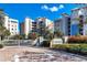 Waterfront community entrance with lush landscaping and elegant signage at 10520 Boardwalk Loop # 504, Lakewood Ranch, FL 34202