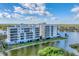 Luxury waterfront condominium building showcasing elegant architecture and scenic lakefront views at 10520 Boardwalk Loop # 504, Lakewood Ranch, FL 34202