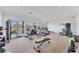 Bright gym featuring an array of workout machines, weights, and water views at 10520 Boardwalk Loop # 504, Lakewood Ranch, FL 34202