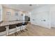Community kitchen with stainless appliances, countertop seating and plank flooring at 10520 Boardwalk Loop # 504, Lakewood Ranch, FL 34202