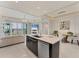 Open floor plan with views of the living, dining, and kitchen areas and water views at 10520 Boardwalk Loop # 504, Lakewood Ranch, FL 34202