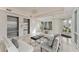 Contemporary condo lobby featuring tiled floors, comfortable seating, modern lighting, and convenient elevator access at 10520 Boardwalk Loop # 504, Lakewood Ranch, FL 34202