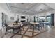 Bright and airy lounge features modern flooring, cozy seating, and access to outdoor amenities at 10520 Boardwalk Loop # 504, Lakewood Ranch, FL 34202