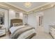 Well-lit main bedroom boasts tray ceilings and neutral paint at 10520 Boardwalk Loop # 504, Lakewood Ranch, FL 34202