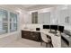 Office features custom cabinets, desk space, and natural lighting at 10520 Boardwalk Loop # 504, Lakewood Ranch, FL 34202