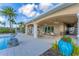 Outdoor poolside patio with fans and lounge seating, perfect for relaxing by the pool at 10520 Boardwalk Loop # 504, Lakewood Ranch, FL 34202