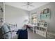 Bright bedroom with a large window, desk area and shelving, perfect for a room or home office at 11050 Sandhill Preserve Dr, Sarasota, FL 34238