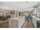 Open-concept kitchen with an island seamlessly connects to the dining and living areas at 11050 Sandhill Preserve Dr, Sarasota, FL 34238