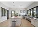 Community kitchen featuring a granite island and stainless steel appliances, plus exterior views at 11050 Sandhill Preserve Dr, Sarasota, FL 34238