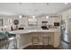 Cozy kitchen featuring stainless steel appliances, a central island, and ample counter space at 11050 Sandhill Preserve Dr, Sarasota, FL 34238