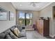Cozy sitting room with large window offering natural light and backyard views at 11050 Sandhill Preserve Dr, Sarasota, FL 34238