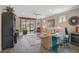 Inviting living room with tile flooring, sliding doors to the lanai, and comfortable seating at 11050 Sandhill Preserve Dr, Sarasota, FL 34238