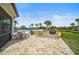 Enjoy the outdoor kitchen with built-in grill and stone surround, adjacent to the community pool and patio at 11050 Sandhill Preserve Dr, Sarasota, FL 34238