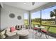 Inviting screened patio with outdoor seating, and a view of the lush landscaping at 11050 Sandhill Preserve Dr, Sarasota, FL 34238