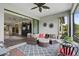 Screened patio featuring comfortable seating, decorative touches, and access to the interior at 11050 Sandhill Preserve Dr, Sarasota, FL 34238
