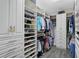 Spacious walk-in closet with custom shelving and storage, offering ample space at 11050 Sandhill Preserve Dr, Sarasota, FL 34238