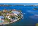 Waterfront homes with private pools, docks, and lush landscaping are seen in this aerial view at 1137 N Lake Shore Dr, Sarasota, FL 34231