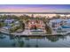 Stunning waterfront home with a pool, patio, tiki hut, and private dock with breathtaking waterfront views at 1137 N Lake Shore Dr, Sarasota, FL 34231