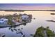 Waterfront homes with private pools, docks, and lush landscaping are seen in this aerial view at 1137 N Lake Shore Dr, Sarasota, FL 34231