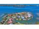 Luxury waterfront community with lush tropical landscaping and private boat docks on a clear, sunny day at 1137 N Lake Shore Dr, Sarasota, FL 34231