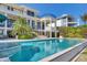 Luxurious backyard showcasing a sparkling pool, elegant architecture, and lush landscaping, creating an outdoor oasis at 1137 N Lake Shore Dr, Sarasota, FL 34231