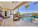 Inviting balcony featuring lounge chairs, seating, and overlooking the pool and serene water views at 1137 N Lake Shore Dr, Sarasota, FL 34231