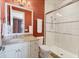 Bathroom featuring a glass shower, vanity with granite counters, and stylish tile work at 1137 N Lake Shore Dr, Sarasota, FL 34231