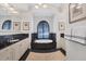 Luxurious bathroom with a soaking tub, black tile accents, and elegant fixtures at 1137 N Lake Shore Dr, Sarasota, FL 34231
