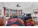 Spacious bedroom with tray ceilings, bay windows, and dark wood flooring at 1137 N Lake Shore Dr, Sarasota, FL 34231