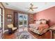 Bedroom with wood floors, and balcony access with views at 1137 N Lake Shore Dr, Sarasota, FL 34231