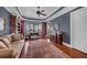 Bedroom with custom ceiling, wood floors, and a cozy couch with a beautiful rug at 1137 N Lake Shore Dr, Sarasota, FL 34231