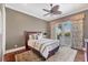Bedroom with natural light and balcony overlooking a view at 1137 N Lake Shore Dr, Sarasota, FL 34231
