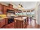 Gourmet kitchen featuring professional grade appliances, an island, a breakfast bar and a dining area at 1137 N Lake Shore Dr, Sarasota, FL 34231