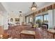 Spacious living room with chandeliers, area rug, and balcony access, great for entertaining at 1137 N Lake Shore Dr, Sarasota, FL 34231