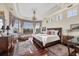 Spacious main bedroom suite with natural light, bay windows, and elegant furnishings at 1137 N Lake Shore Dr, Sarasota, FL 34231