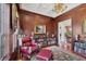 Cozy office with wood paneling, built-in bookshelves, and comfortable seating at 1137 N Lake Shore Dr, Sarasota, FL 34231
