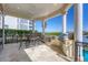 Outdoor kitchen features a built-in grill, bar seating, and stunning views, perfect for entertaining at 1137 N Lake Shore Dr, Sarasota, FL 34231